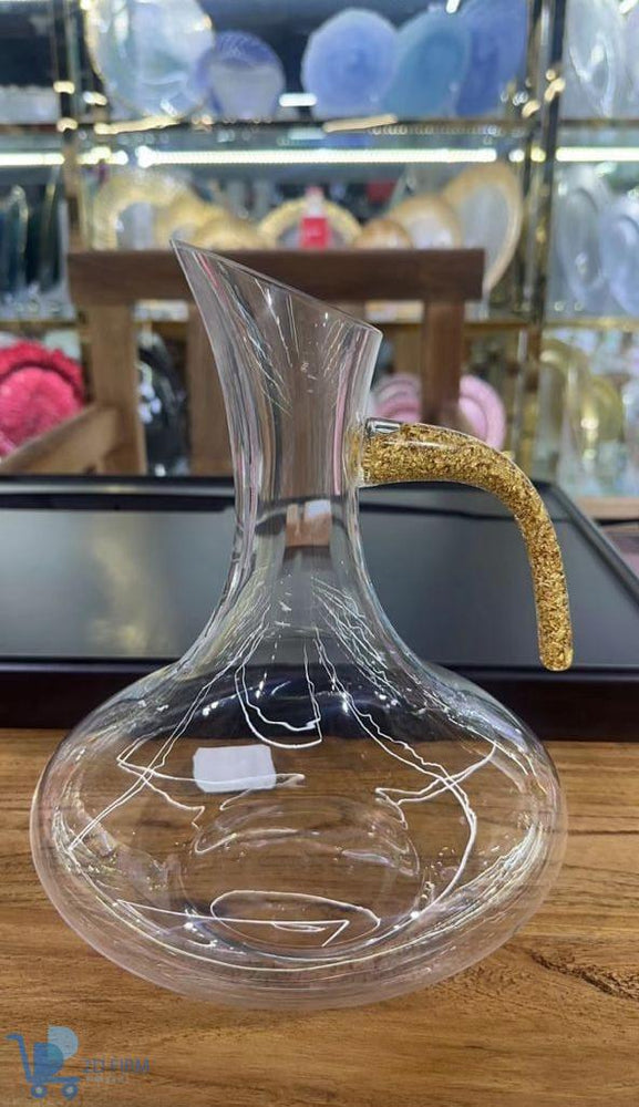 Très belle carafe en cristal avec poignet dorée